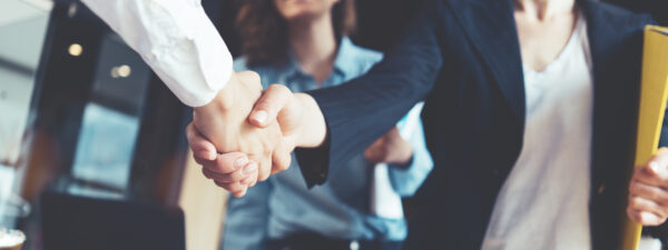 featured photo business shaking hands industry hiring jobs teamwork