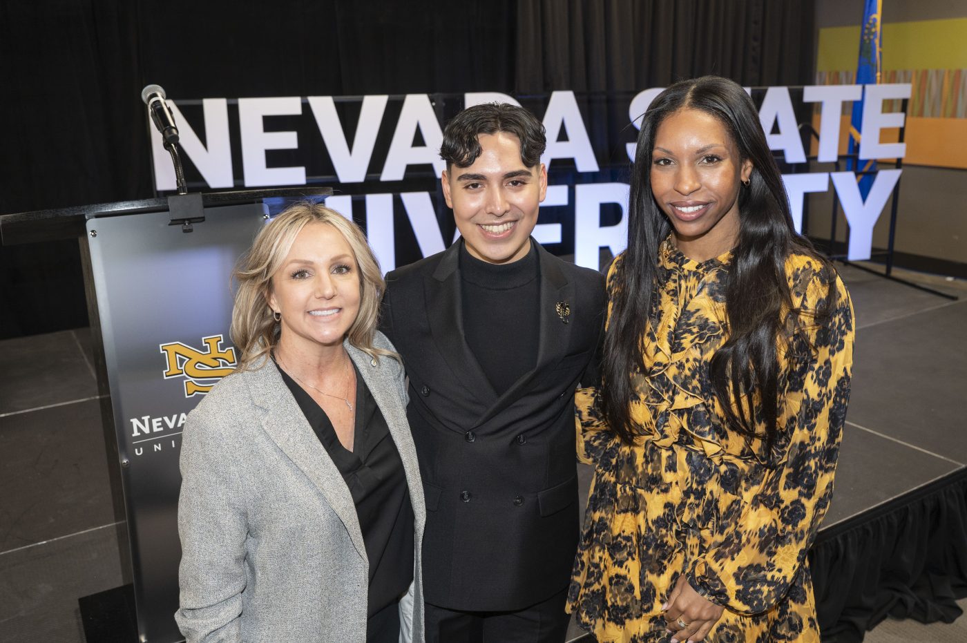 LVGEA intern Kevin Osario Hernandez posing with other LVGEA team members at the Nevada State University state of the university event