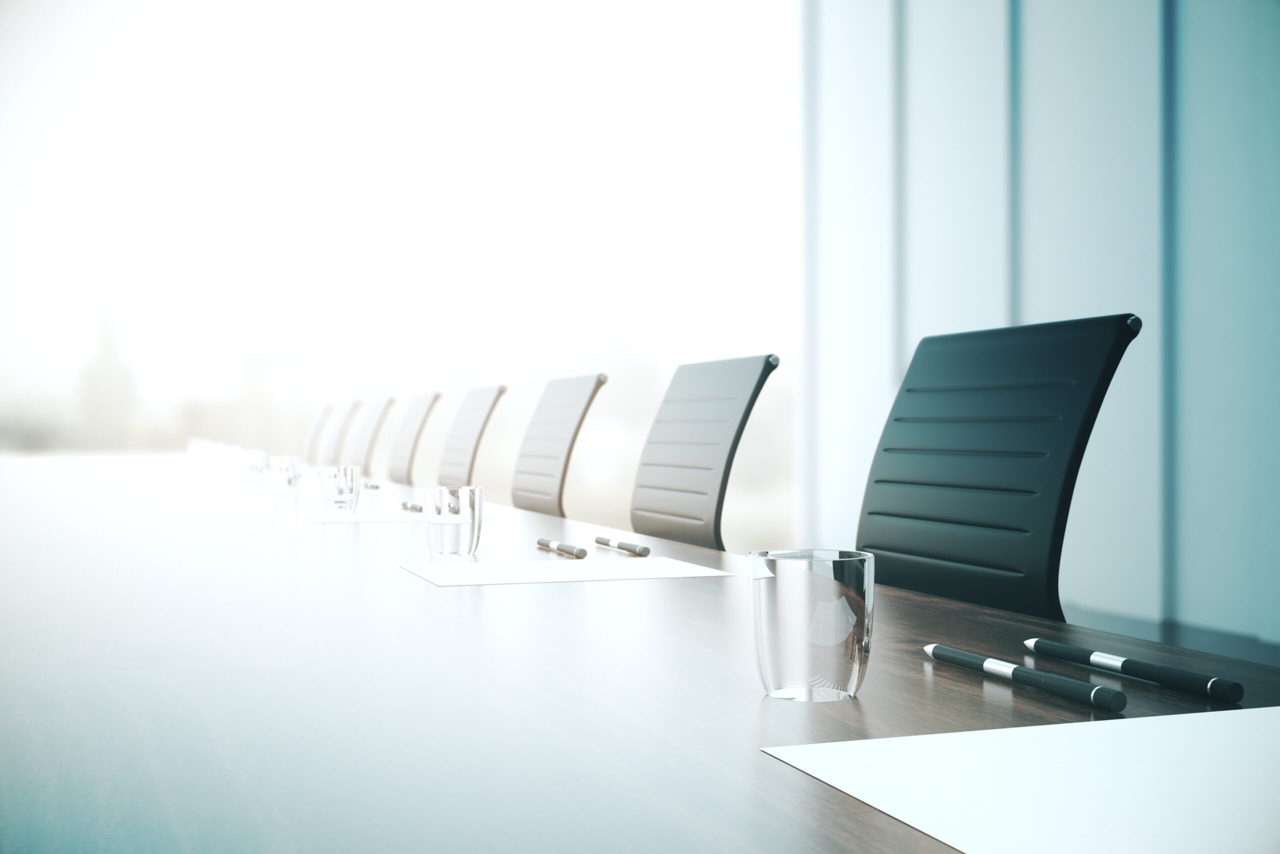 Table with equipment in conference room.