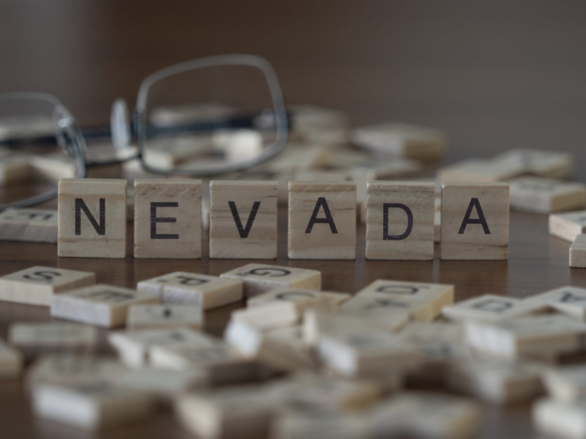The concept of the state Nevada represented by wooden letter til